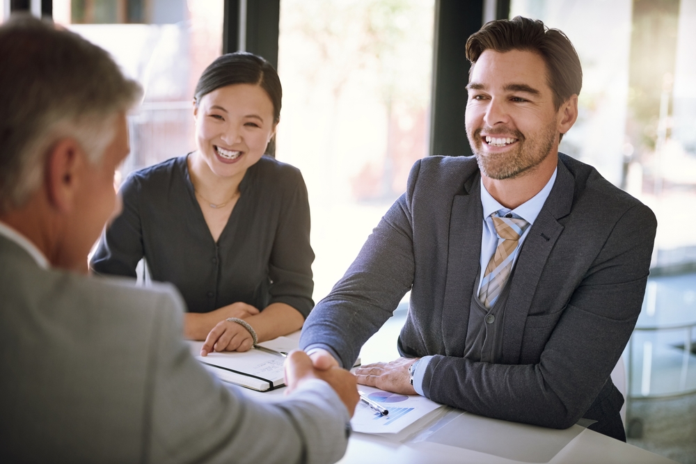 accountant shaking hands with new client at CPA firm